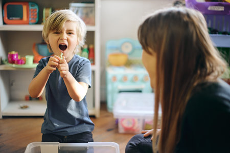 Fun, playful and the portrait of a child with a teacher for play therapy and mental development....