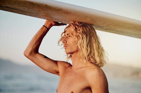 Sports, surfer and man at a beach with surfboard for surfing, fitness and adventure. Water, sport...