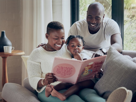 Black family, home and reading book for learning, fairytale and support kid in education. Love, parents and child listening to fantasy literature in lounge, language development and bonding togetherの写真素材