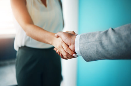 Business people, b2b and handshake closeup for merger negotiation, funding agreement and deal. Corporate success, meeting and entrepreneur greeting investor for collaboration, trust and partnershipの写真素材