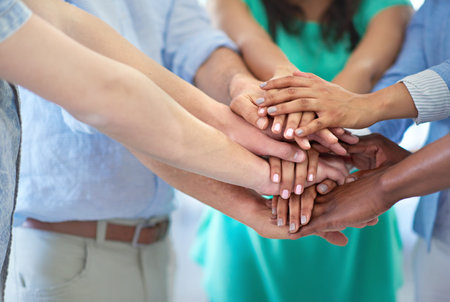 Creative people, teamwork and hands together with support for unity, trust or collaboration at...