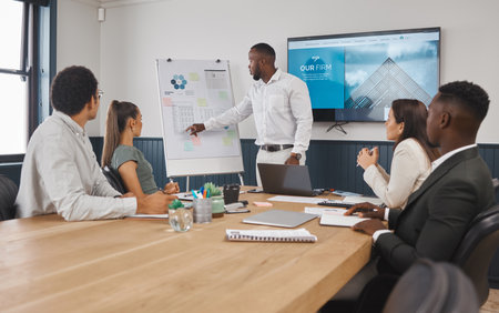 Architect, presentation and people in meeting, boardroom and speaker with ideas, talking and design goals. Monitor, discussion and teamwork for architecture, display and brainstorming with groupの写真素材