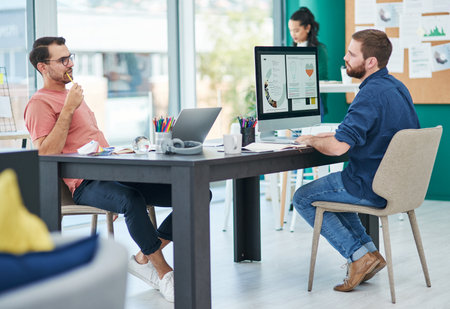 Discussion, technology and business people in office for feedback, review or update on project. Meeting, partnership and IT specialists with problem solving in collaboration for web development.の写真素材