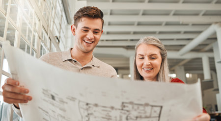 Office, mentor and business people with blueprint for architecture, planning and project management. Teamwork, employees and architects with solution for floor plan, building design or smile for ideaの写真素材