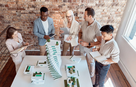 People, building model and architecture planning in office for innovation, urban development and environment aware design. Engineer team, discussion and 3D structure in firm for property constructionの写真素材