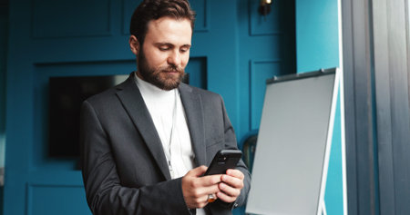 Office, businessman and reading with mobile for notification, news and online article for...