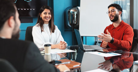 Happy, business people and discussion with laptop for financial growth, proposal or company progress at office Group, employees or financel team with paperwork for profit review or statistics reportの写真素材