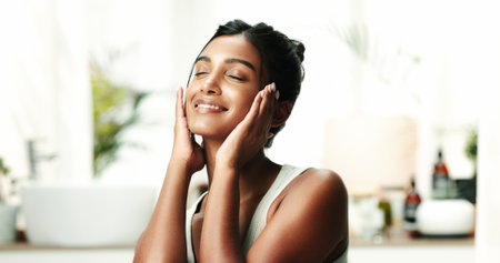 Happy woman, relax and calm with skincare for beauty, cosmetics or spa day at home. Face, female person or smile with soft skin, dermatology or cosmetology for facial glow, shine or hygiene at houseの写真素材