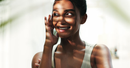 Skincare, woman and cosmetics with dermatology, smile and confidence with wellness. Person, beauty and girl with grooming routine, treatment for acne and glow with clear skin and aesthetic with shineの写真素材