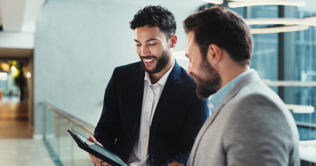 Office, smile and men with tablet, online and showing of financial report for audit, accountant or digital. Business, people and bookkeeper with budget for investment, meeting and happy for revenueの写真素材