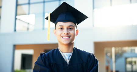 Portrait, man, and smile for graduation outdoor of education achievement, learning goals and ceremony. Happy, male student and studying success of university degree, celebration and academic progressの写真素材