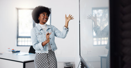Meeting, whiteboard and training with business black woman in office for coaching or development. Presentation, seminar and upskill speaker in design workplace for education or planning for projectの写真素材