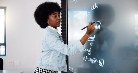 Education, black woman and student by board in classroom explaining science equation at college....