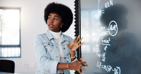 Education, black woman and student by board in lecture explaining science equation to class at...
