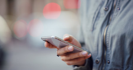 Smartphone, browsing and hands of student, online and checking of email for application results or education. Outdoor, person and scroll for feedback from college, digital or waiting for notificationの写真素材