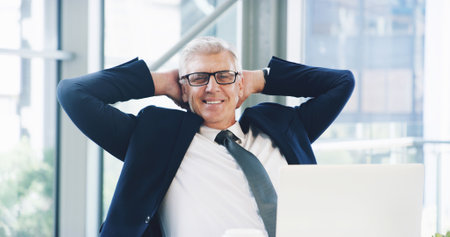 Success, portrait and laptop with business man in office for corporate venture capital, deal closer or private equity. Planning, finance return and satisfied with mature employee for portfolio assetsの写真素材