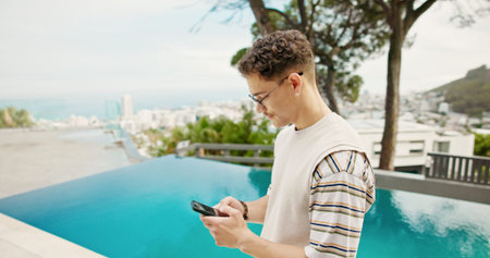 Pool, vacation and man with cellphone, travel and weekend break with internet. Hotel, summer holiday...