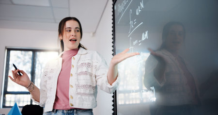 Education, woman and student by board in classroom explaining science equation at college. Revision,...