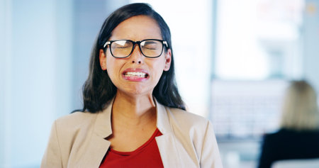 Crying, sad and woman with burnout, office and overwhelmed with work for internship, stress or business. Frustrated, overworked and person with anxiety for mistake, depressed or employee with glassesの写真素材