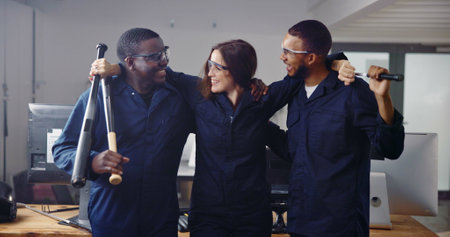 Diversity, weapon and friends in rage room for release, anger management and stress relief. Bat, safety gear and satisfied with people in smash center for demolition success and cathartic therapyの写真素材