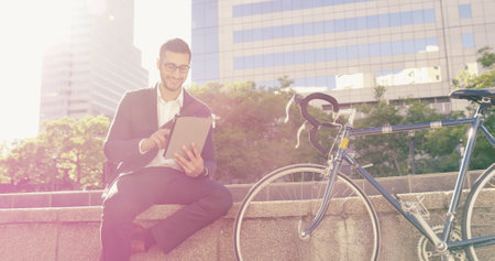 Business, man and smile on tablet for urban navigation, travel directions and schedule update. Male person, bicycle commute and digital with online maps, journey information and negotiation as lawyerの写真素材