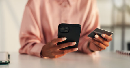 Business, hands and woman with smartphone, credit card and fintech with online shopping. Person, fashion designer or entrepreneur with cellphone, payment or transaction with password or trading moneyの写真素材