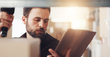 Checklist, boxes and man with scanner for logistics, stock check or inventory in startup. Barcode reader, clipboard and shipping worker with supply chain, cargo or freight inspection for distributionの写真素材