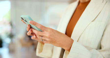 Phone, hands and manager with business woman in office for nft artist, minting platform and client sales. Creative studio, digital artwork and virtual asset with employee closeup for networkingの写真素材