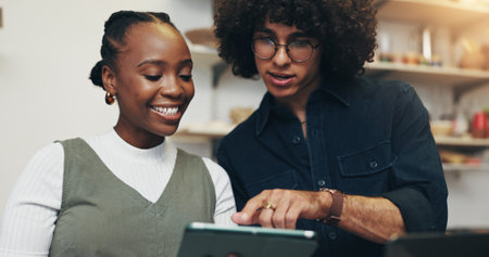 Workshop, people or startup with tablet for pottery, design inspiration or verification for order. Small business, man or woman as ceramist with scroll for clay ecommerce, track inventory or teamworkの写真素材