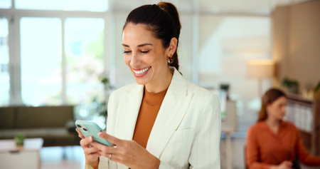 Phone, happy and manager with business woman in office for nft artist, minting platform and client sales. Creative studio, digital artwork and virtual asset with employee for global marketplaceの写真素材