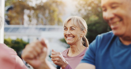 Senior woman, exercise and group in garden at retirement village, health and fitness class in...