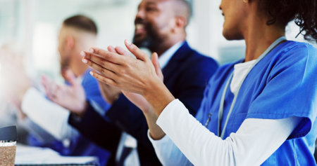 People, applause and doctors in hospital, meeting and achievement with breakthrough research. Group, clapping and employees in clinic, seminar and celebration with goals, opportunity and cheeringの写真素材