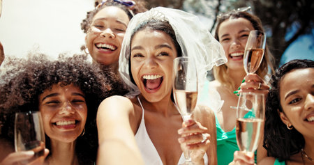 Selfie, champagne and bachelorette party with women at hotel for summer, celebration and holiday. Travel, portrait and bridal shower with group of friends at resort for memories, vacation and supportの写真素材