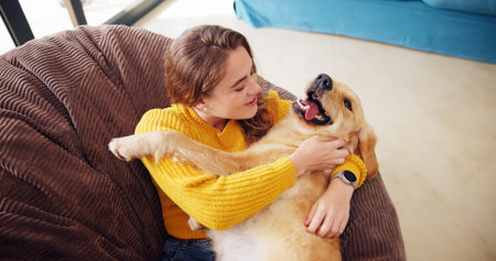 House, above and woman with dog, relax and bonding together with smile, happiness and play. Apartment, pet and person on sofa, comfort and domestic animal with care, best friend and resting in loungeの写真素材