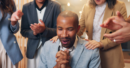 Excited businessman, surprise or applause in promotion, announcement or office negotiation success. Group of employees, clapping or winner congratulations for partnership, prize or workplace contractの写真素材