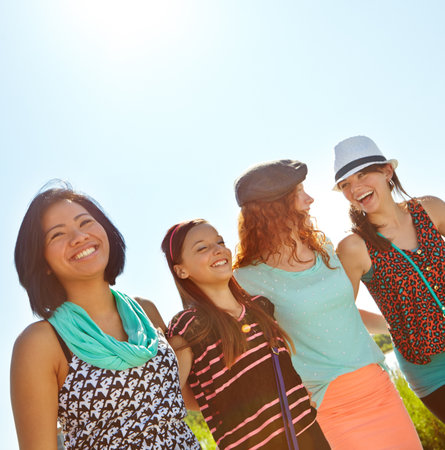 Walking, happy and friends with girls in nature for school holiday, teenagers and support. Vacation, youth and adventure with group of people and embrace outdoors for peace, mockup space and travelの写真素材