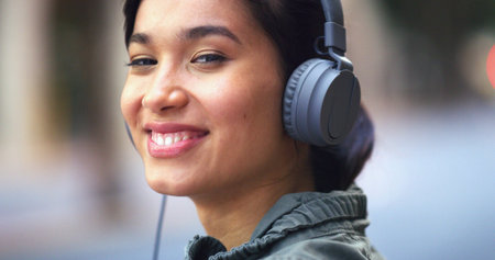 Headphones, travel and portrait of woman in city with music for commuting to university in morning....