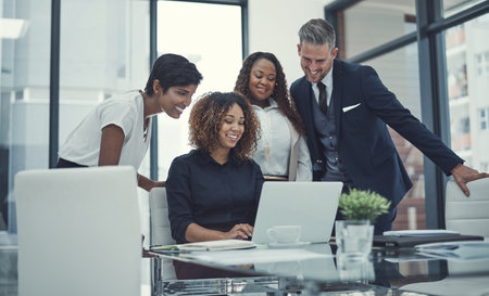 Laptop, smile or business people in meeting with research for feedback, discussion or teamwork. Corporate report, online news or financial advisor talking to economists for economy or collaborationの写真素材