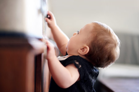 Cabinet, climbing and development with baby girl in home for curiosity, discovery or growth....