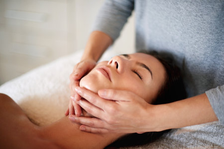 Massage, woman and masseuse hands for therapy at spa, beauty treatment and holistic healing with skincare. Person, luxury resort and client pressure at salon, cosmetic service and smooth or soft skinの写真素材