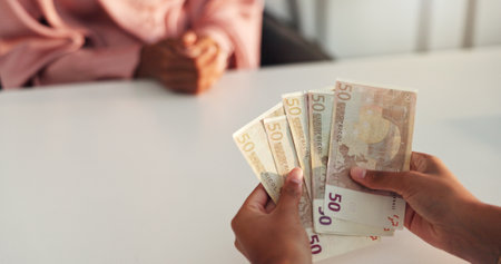 Money, counting and hands of people for salary payment, company investment and funding. Business meeting, corporate and workers with cash exchange for financial service, budget and deposit in officeの写真素材