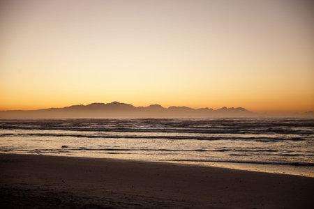 Waves, sunset and horizon of calm beach, nature and travel destination landscape of environment....