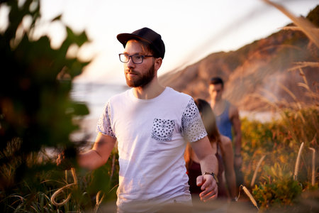 Adventure, fitness or hiking and man in mountains with friends for exploration, journey or travel....