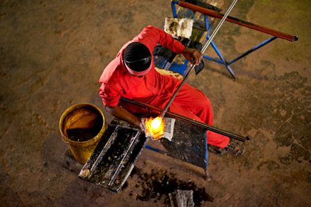 Above, glassblower and man with equipment, skills and heat with craftsmanship, material and talent....