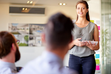 Architecture, presentation and tablet with woman in office for client proposal, progress update and planning. Construction project, renovation timeline and engineering firm with business peopleの写真素材