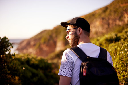 Man, view and hiking trip in nature, fitness and outdoor travel for cardiovascular wellness....
