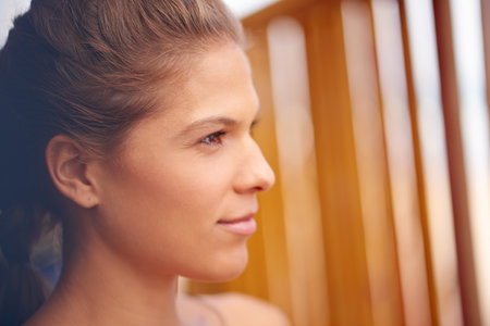 Beachside cabin, thinking and woman with vacation, travel and daydreaming with break. Happy person, outdoor and adventure with girl, natural and summer holiday with decision, choice and tourismの写真素材