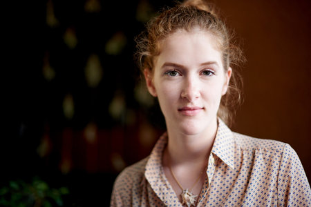 Portrait, student and woman in university, confident and serious for education in academy and calm. College, back to school and person with scholarship for knowledge, campus and future in Canadaの写真素材