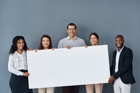 Group, business people and portrait with banner for advertising, marketing and corporate announcement. Gray background, men and women with mockup space for poster, billboard and about us with messageの写真素材