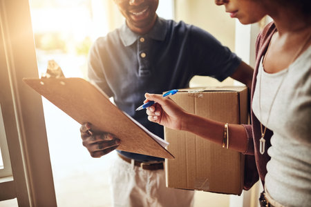 Hands, clipboard and signature for delivery man, smile and ecommerce with shipping paperwork or cargo. Courier, client and logistics with distribution, box or supply chain for online retail or importの写真素材
